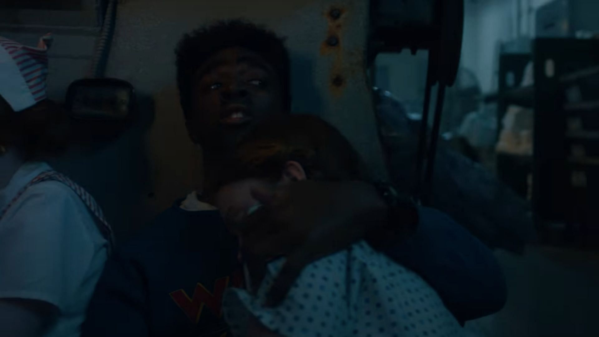 Max and Lucas hide from Vecna's monsters (Image via YouTube/Netflix)